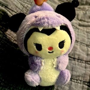 Kuku mini, plush in a dinosaur costume